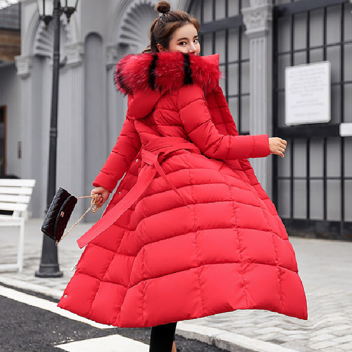 Quilted women's winter coat with hood and belt