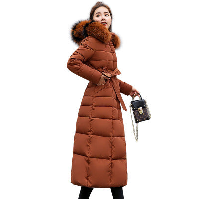 Quilted women's winter coat with hood and belt