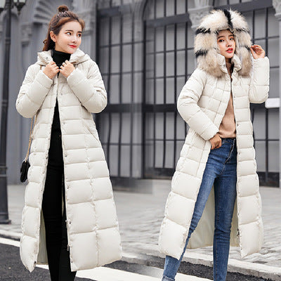 Quilted women's winter coat with hood and belt