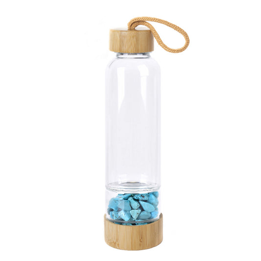 Glass water bottle with energy crystal pebbles